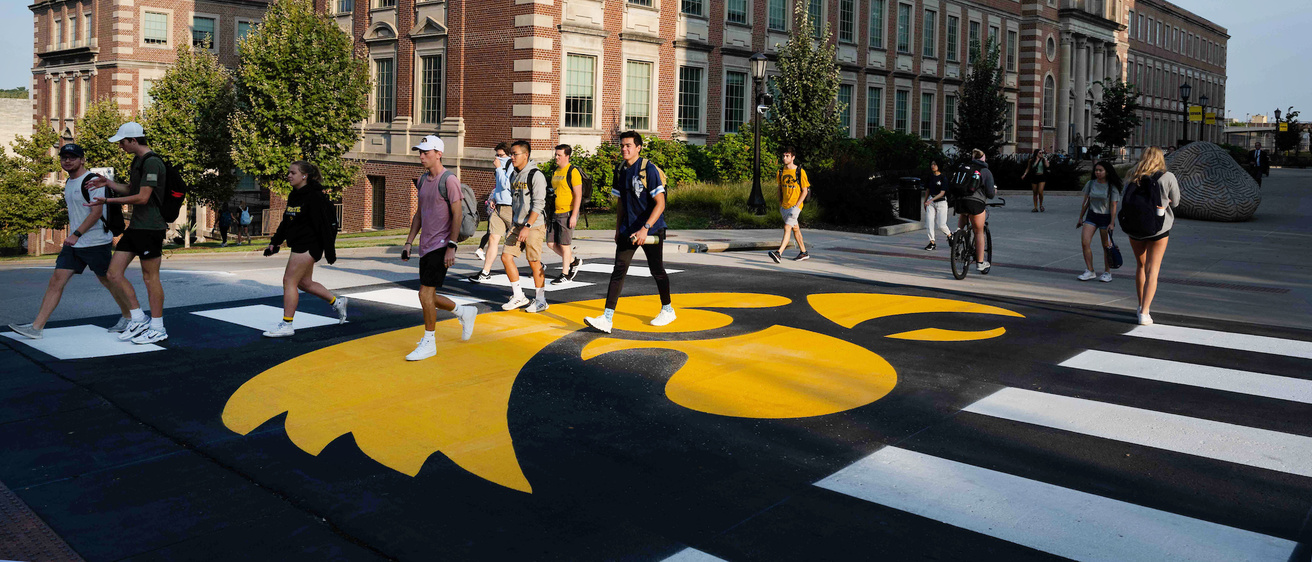 students walking on tigerhawk crosswalk in front of the Chemistry Building