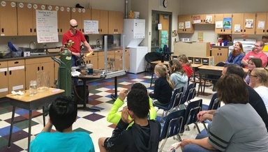 children in classroom learning about science